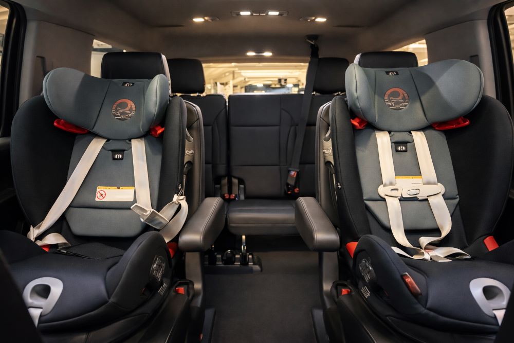 Luxury SUV interior with child car seats for private Disney airport transportation
